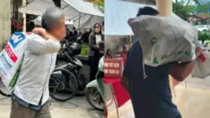 Người dân vác bao tải đi đựng tiền đền bù đất siêu dự án Olympic