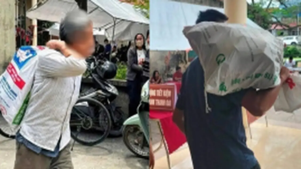 Người dân vác bao tải đi đựng tiền đền bù đất siêu dự án Olympic