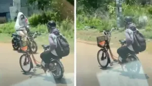 Xác minh thiếu niên ngồi ghế sau, buông 2 tay chạy xe đạp điện trên quốc lộ 13